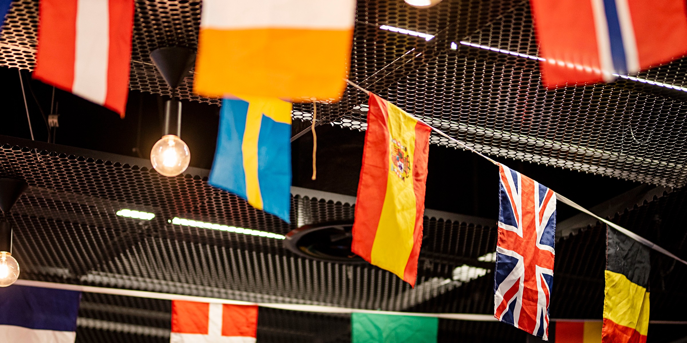 Image of rows of flags from various nations.